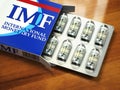 Concept of IMF tranches. Pack of dollars as pills in blister pac