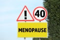 Concept of impending menopause at 40 years old. Post with dIfferent signs outdoors