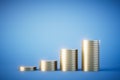 The concept of increasing revenues. growing stacks of coins on a blue background. 3D render Royalty Free Stock Photo