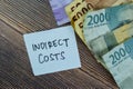 Concept of Indirect Costs write on sticky notes isolated on Wooden Table Royalty Free Stock Photo