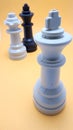 concept of infidelity in chess pieces, chess game, plastic chess pieces, infidelity of the queen, king and queen Royalty Free Stock Photo