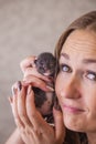 The concept of innocence. Portrait of a girl with a little kitten