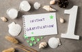 Concept of instant gratification. Text on paper. Royalty Free Stock Photo