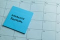 Concept of Insurance Renewal write on sticky notes isolated on Wooden Table Royalty Free Stock Photo