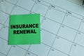 Concept of Insurance Renewal write on sticky notes isolated on Wooden Table Royalty Free Stock Photo