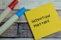 Concept of Intention Matters write on sticky notes isolated on Wooden Table Royalty Free Stock Photo