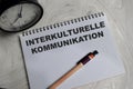 Concept of interkulturelle kommunikation write on book isolated on Wooden Table Royalty Free Stock Photo