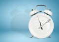 Concept of intermittent fasting, lunchtime, diet and weight loss. Plate as Alarm clock on blue Royalty Free Stock Photo