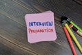 Concept of Interview Preparation write on sticky notes isolated on Wooden Table