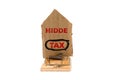 The concept of investment Banks. Mousetrap with a cardboard house, with the inscription HIDDE TAX. Isolate and copy space