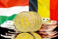 Bitcoins on Belgium and Hungary flag background