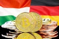 Bitcoins on Hungary and Germany flag background
