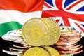 Bitcoins on Hungary and UK flag background