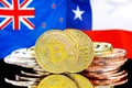 Bitcoins on New Zealand and Chile flag background