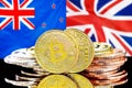 Bitcoins on New Zealand and United Kingdom flag background
