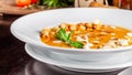 The concept of Italian cuisine. Pumpkin cream soup with orange flavor, chicken pieces, bread croutons and cream Royalty Free Stock Photo