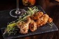 The concept of Italian cuisine. Snack to beer. Glazed chicken legs and chicken wings, breaded. Serving dishes in the restaurant Royalty Free Stock Photo