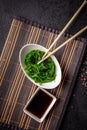 The concept of Japanese and Chinese cuisine. Chuka Salad, made from seaweed, sesame, olive oil and spices. soy sauce Royalty Free Stock Photo