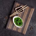 The concept of Japanese and Chinese cuisine. Chuka Salad, made from seaweed, sesame, olive oil and spices. soy sauce Royalty Free Stock Photo