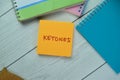 Concept of Ketones write on sticky notes isolated on Wooden Table