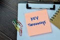 Concept of Key Takeaways write on sticky notes isolated on Wooden Table Royalty Free Stock Photo