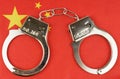There are handcuffs on the flag of China.
