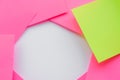 The concept of leadership, dissimilarity, individuality. One green sticky among many pink ones