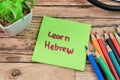 Concept of Learn Herbrew write on sticky notes isolated on Wooden Table