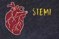 Concept of learning cardiovascular system. Chalk drawing of human heart and inscription STEMI Royalty Free Stock Photo