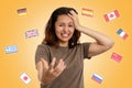 Concept of learning foreign languages. A young woman clutches her head, experiencing stress and difficulties in learning Royalty Free Stock Photo