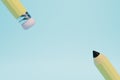 the concept of learning to draw. a simple pencil with an eraser rubber band on a blue background. copy paste. 3D render Royalty Free Stock Photo