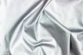 Concept for leather, textile and texture - closeup of crumpled gray silver metallic leather Royalty Free Stock Photo