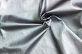 Concept for leather, textile and texture - closeup of crumpled gray silver metallic leather Royalty Free Stock Photo