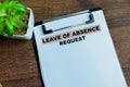 Concept of Leave of Absence Request write on paperwork isolated on wooden background Royalty Free Stock Photo