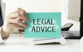 Concept Legal Advice message on notebook with glasses  pencil and coffee Royalty Free Stock Photo