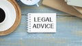 Concept Legal Advice message on notebook with glasses, pencil and coffee cup Royalty Free Stock Photo