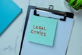 Concept of Legal Ethics write on sticky notes isolated on Wooden Table Royalty Free Stock Photo