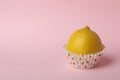 Concept of lemon cupcake on pink Royalty Free Stock Photo