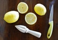 Concept with lemons and lemon squeezer
