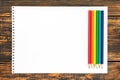 Colored pencils painted in LGBT colors and white card Royalty Free Stock Photo