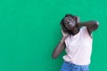 The concept of lifestyle and people - a smiling African-American young woman listening to music with headphones. The joy and Royalty Free Stock Photo