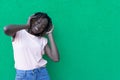 The concept of lifestyle and people - a smiling African-American young woman listening to music with headphones. The joy and Royalty Free Stock Photo