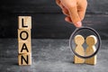 The concept of `Loan`. Businessmen are discussing questions about the company`s loans. The financial loans between the lender and