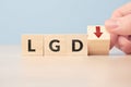 Concept Loss given default or LGD. business acronym. Cubes with letters and an arrow down. Royalty Free Stock Photo