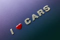 Concept of love of cars, motoracing. Letters on carbon fiber background Royalty Free Stock Photo