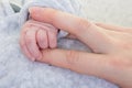 Concept of love and family. hands of mother and newborn baby closeup Royalty Free Stock Photo