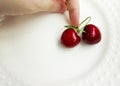 The concept of love - heart from berries of a sweet cherry.Isolated cherry. Heart shape from two cherries isolated white Royalty Free Stock Photo