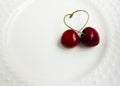 The concept of love - heart from berries of a sweet cherry.Isolated cherry. Heart shape from two cherries isolated white Royalty Free Stock Photo