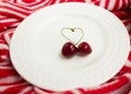 The concept of love - heart from berries of a sweet cherry.Isolated cherry. Heart shape from two cherries isolated white Royalty Free Stock Photo