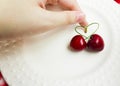 The concept of love - heart from berries of a sweet cherry.Isolated cherry. Heart shape from two cherries isolated white